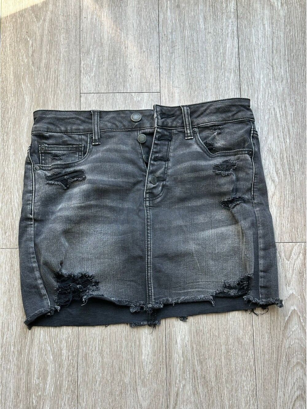 American Eagle Women's dark grey distressed denim mini skirt